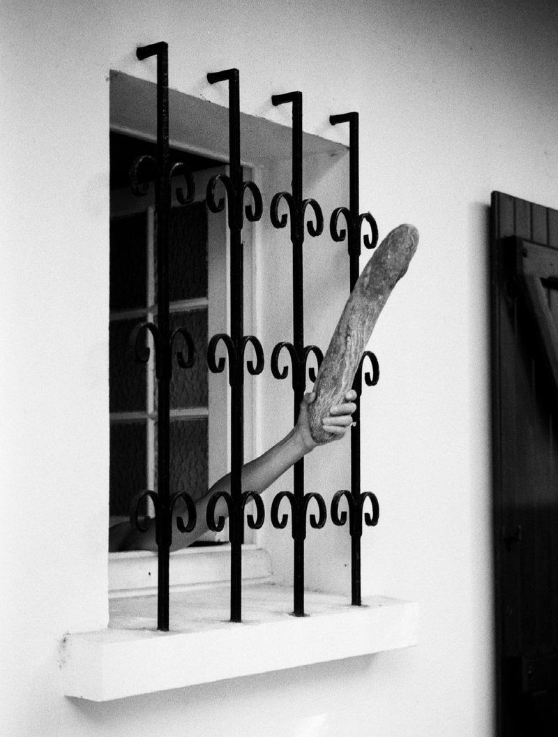 baguette through the bars